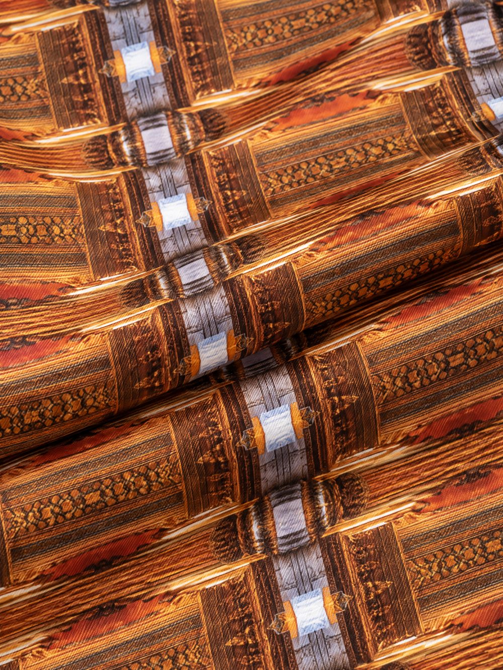 Close-up of As Above So Below printed on folded fabric
