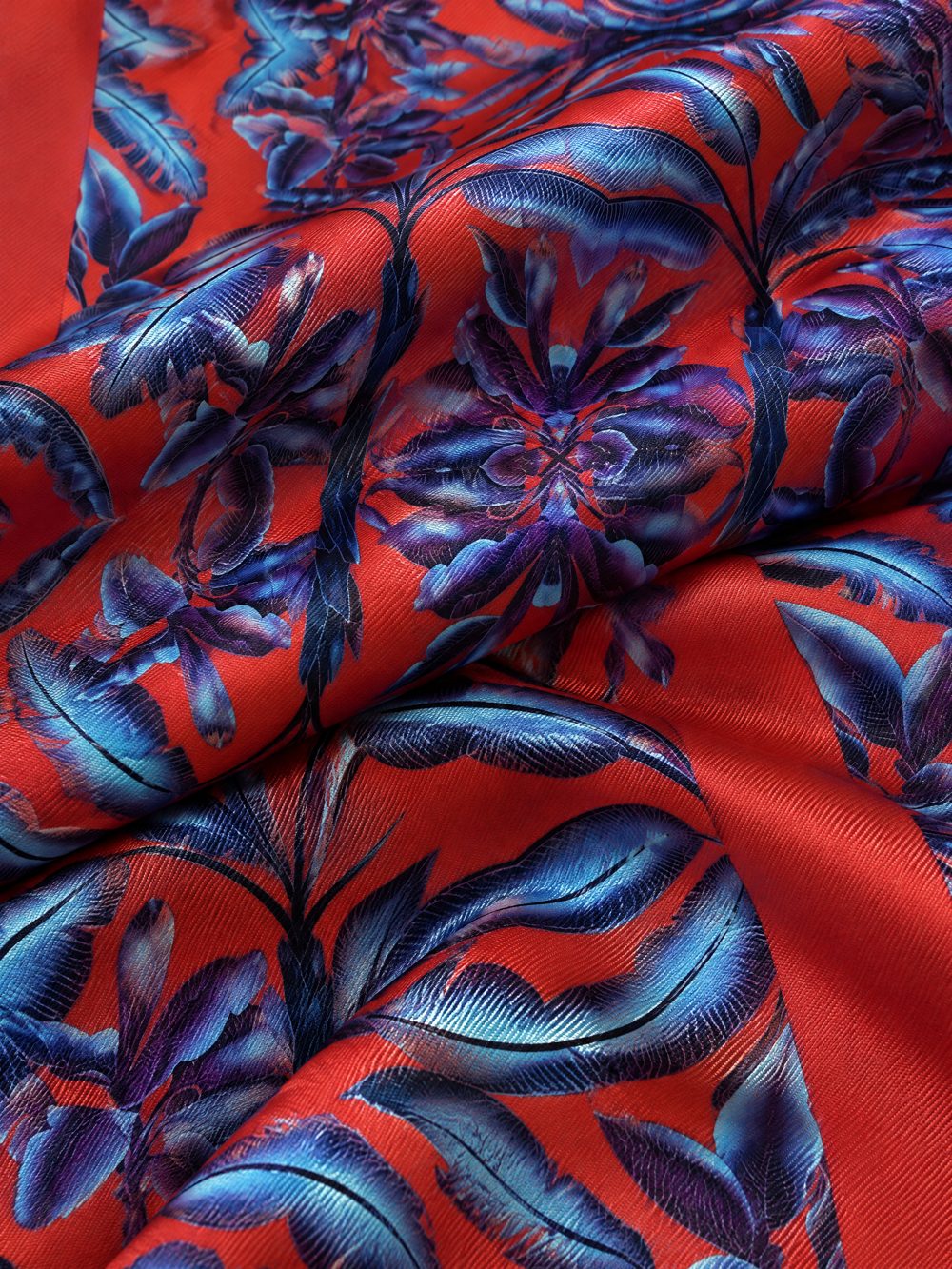 Close-up of Blue Dragons on Vermilion Ground printed on folded fabric