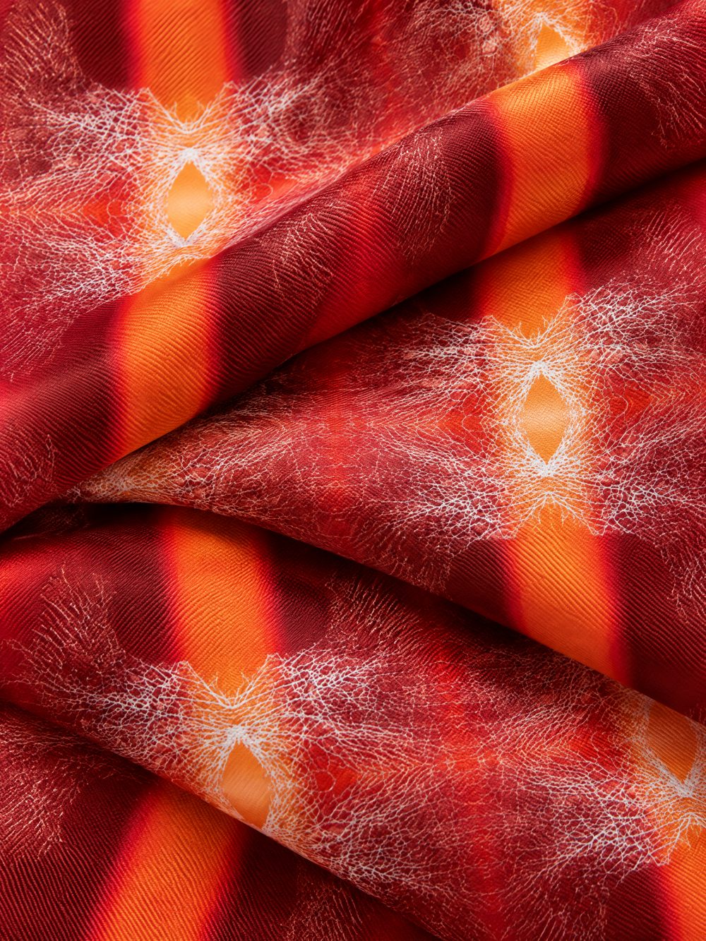 Close-up of Feel the Electricity in the Air printed on folded fabric