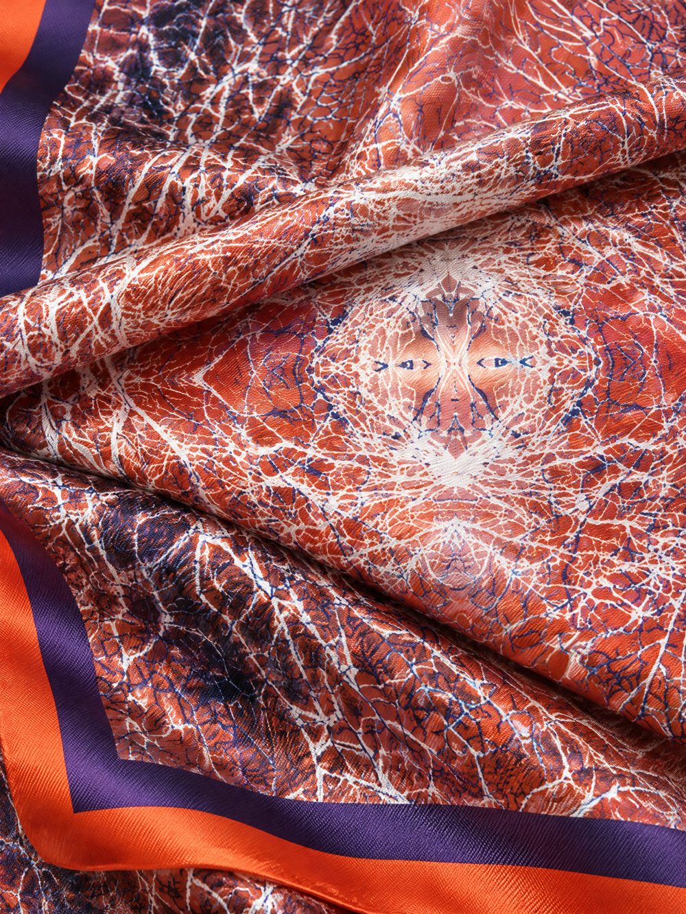 Close-up of Feel the Electricity in the Air printed on folded fabric