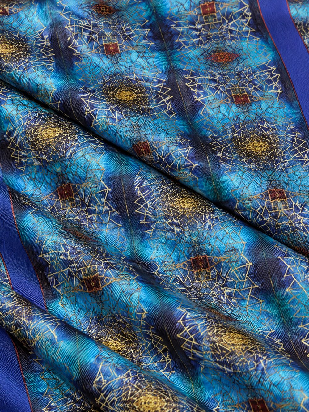 Close-up of Golden Screen Against the Sea printed on folded fabric