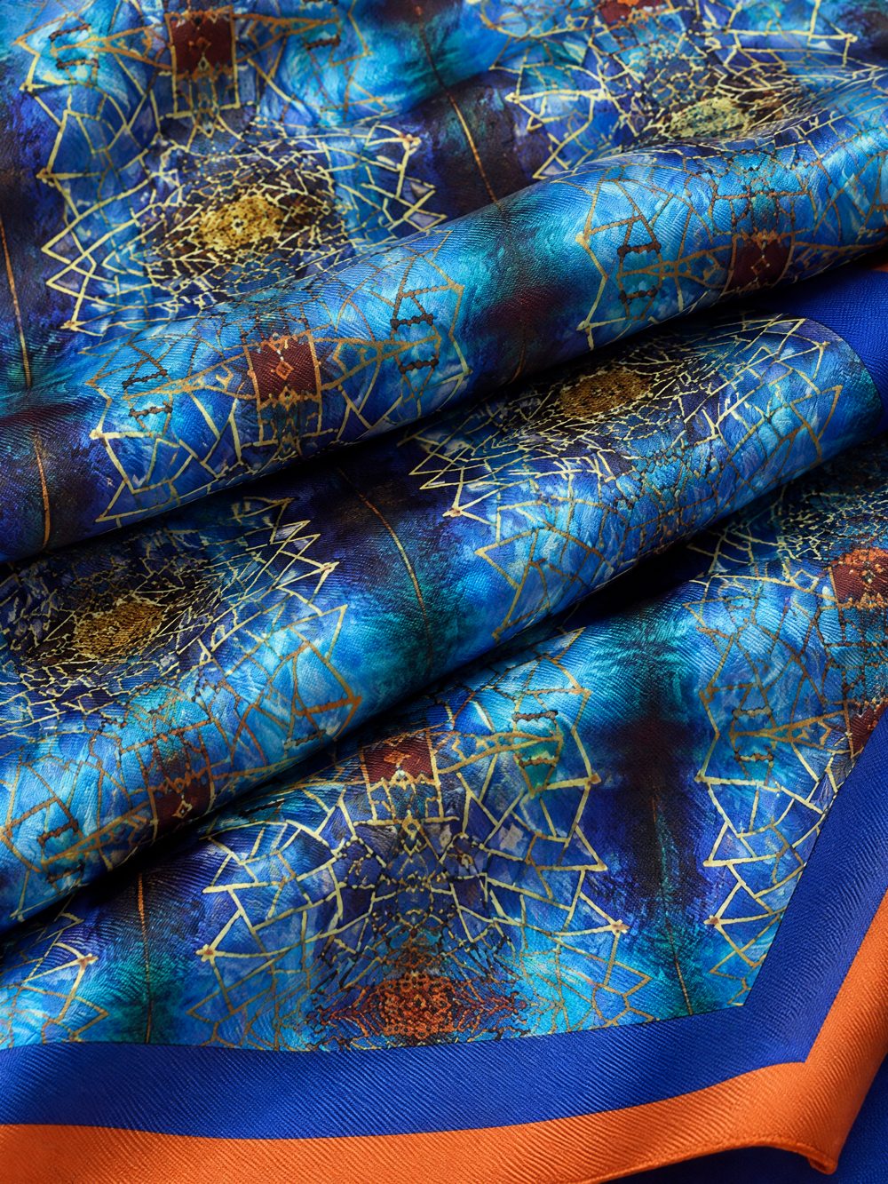 Close-up of Golden Screen Against the Sea printed on folded fabric