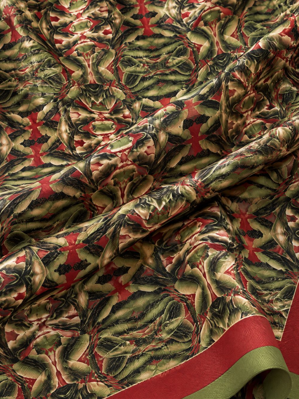 Close-up of Green and Black Chessboard Leaves printed on folded fabric