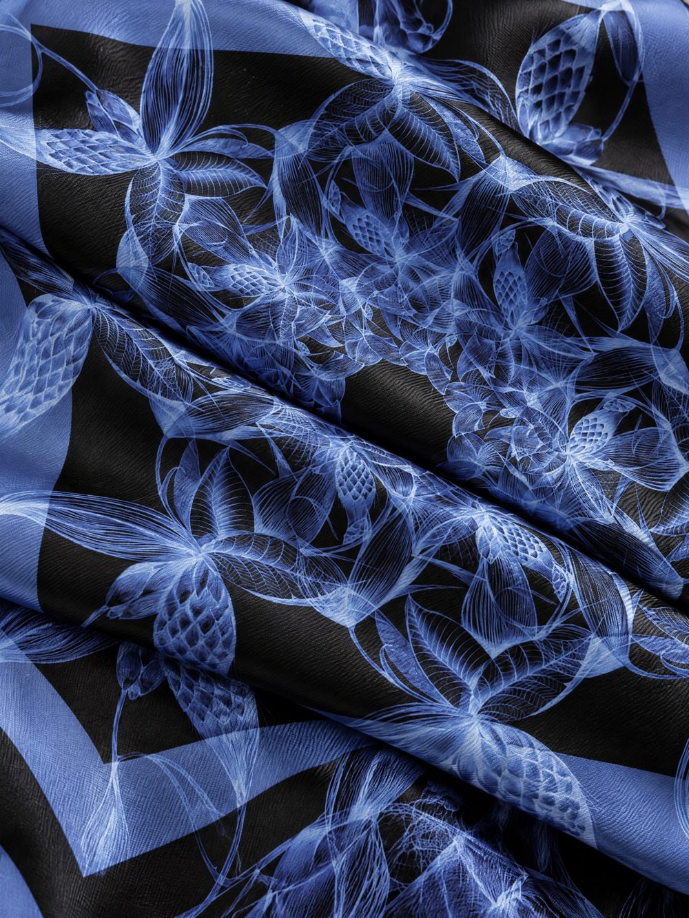 Close-up of Rotating Botanicals printed on folded fabric