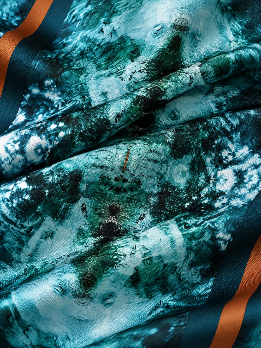Close-up of The Dark Dark Sea printed on folded fabric