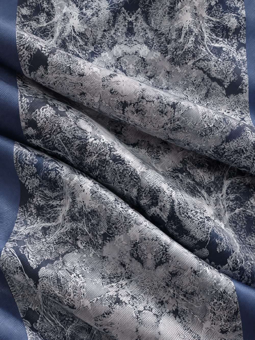 Close-up of The Forest Sleeps printed on folded fabric