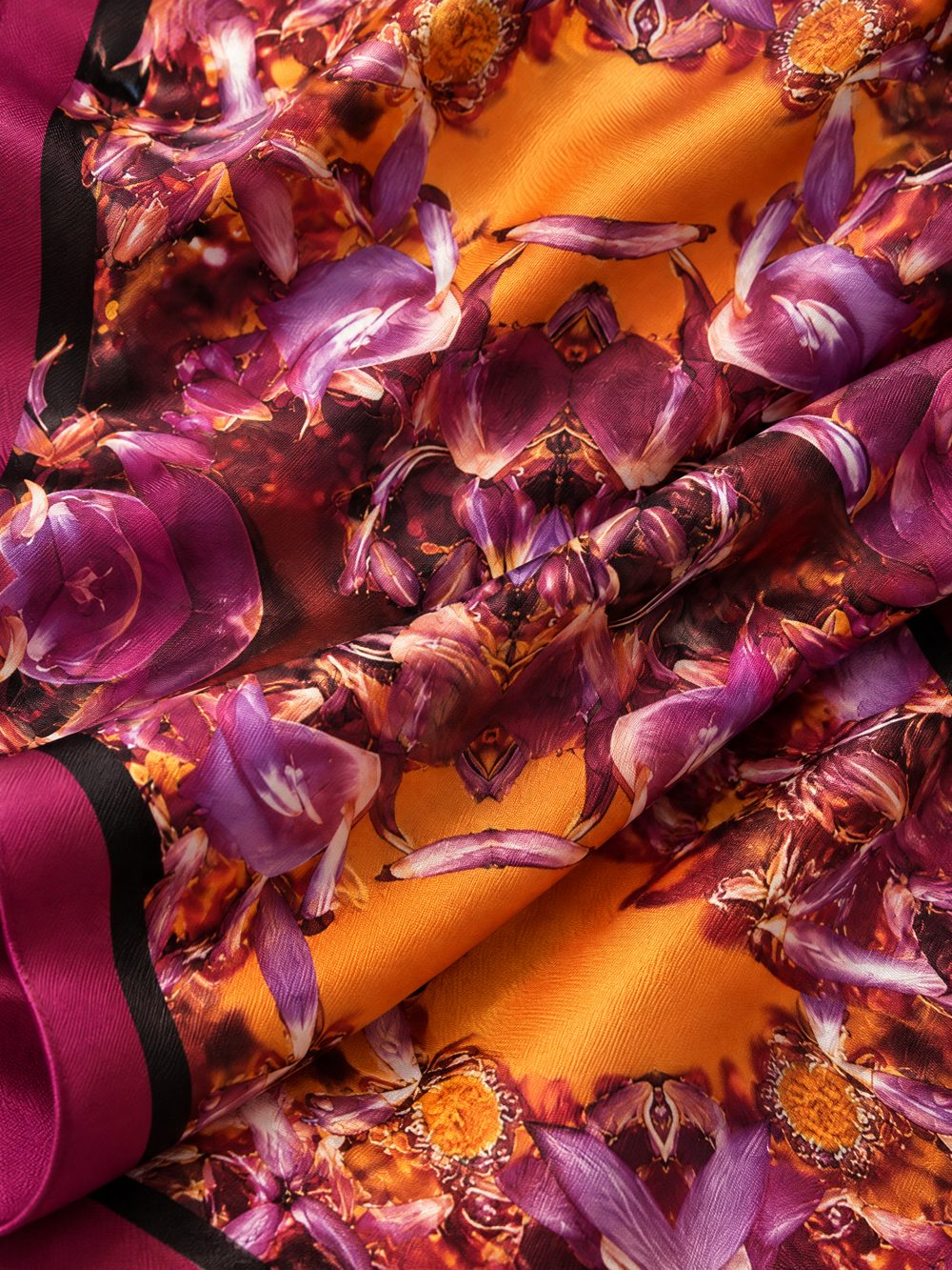 Close-up of The Lotus Glows printed on folded fabric