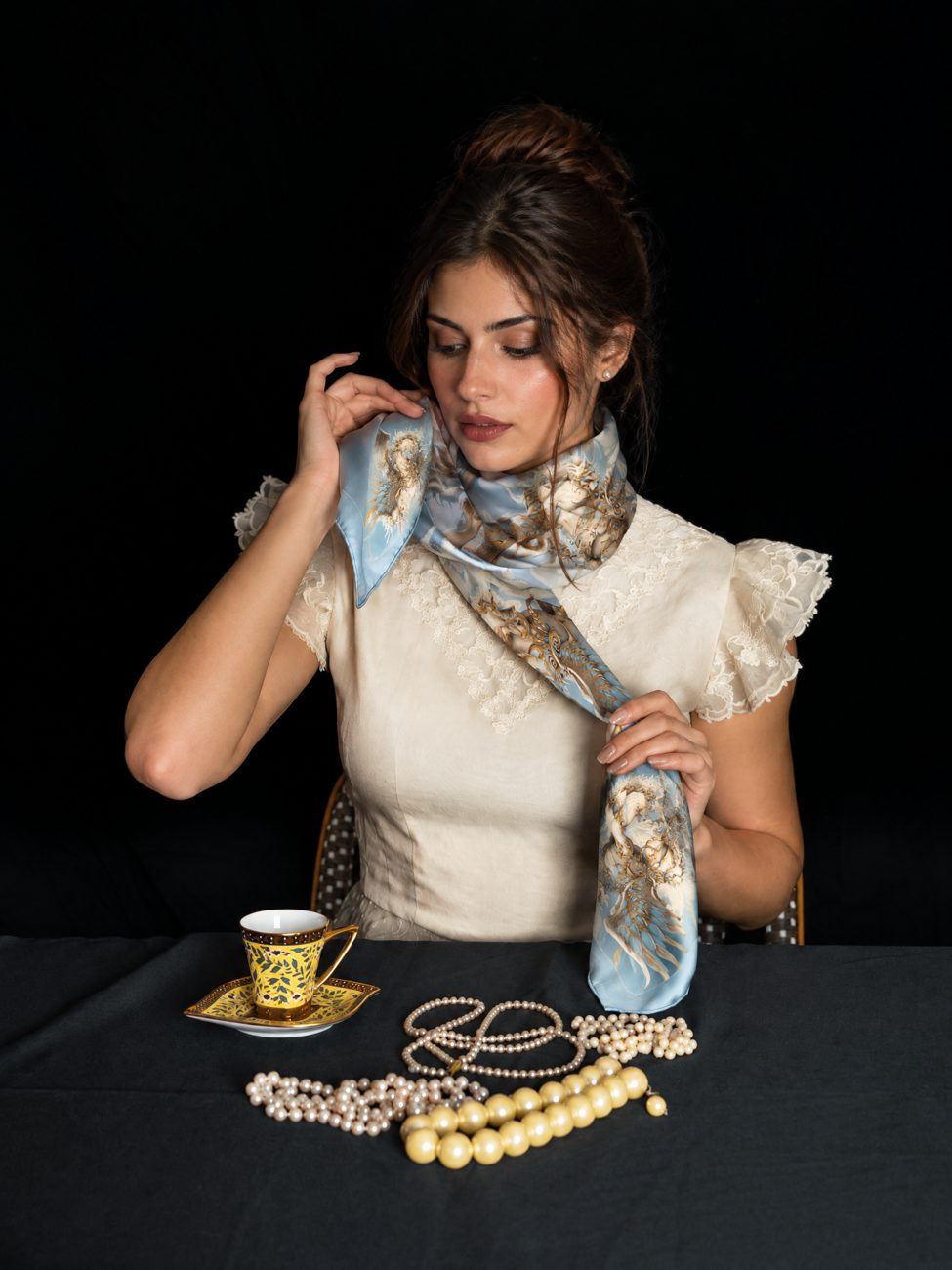 The Winged Qilin silk scarf being worn